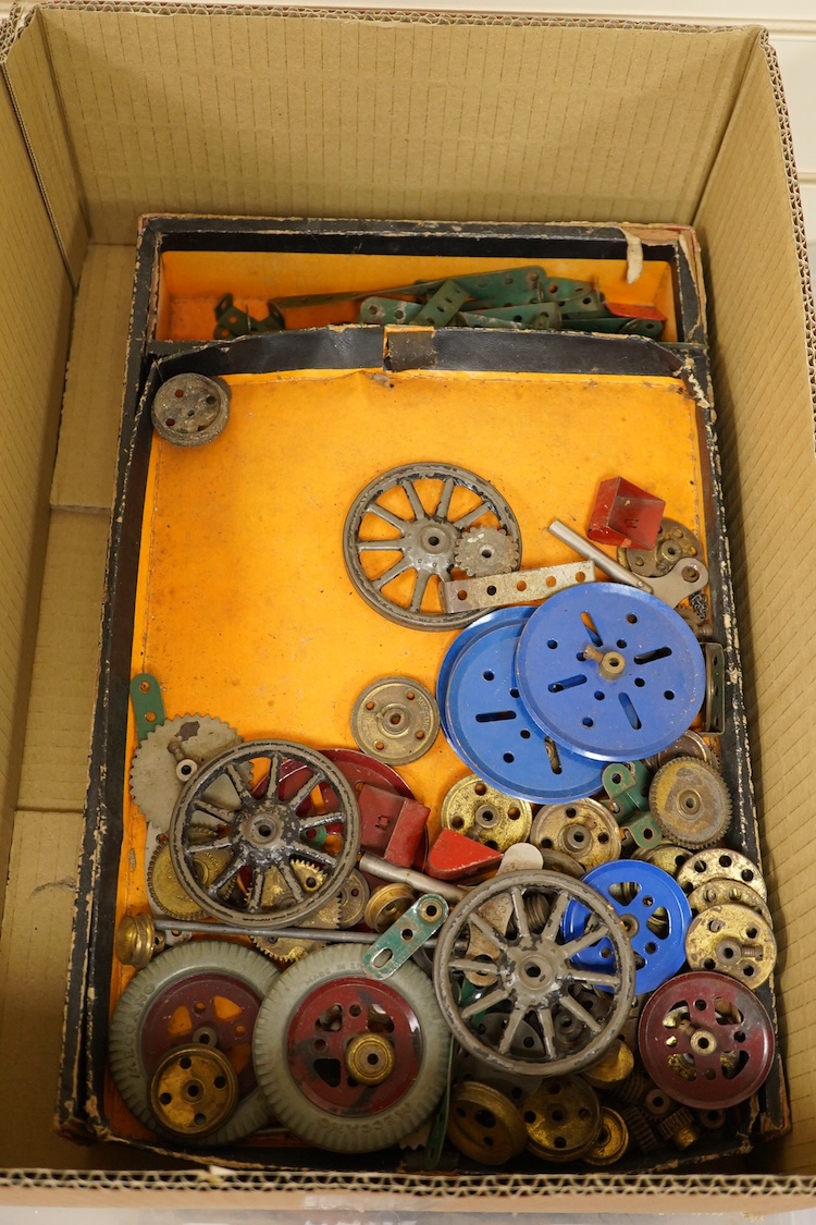 A large quantity of early Meccano construction parts, including a variety of specialist parts from the earliest sets produced and the original box for set No.3